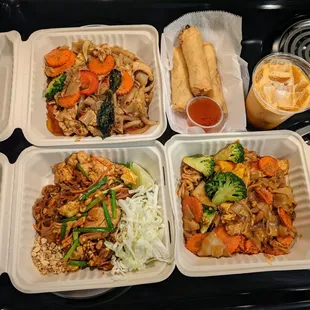 Clockwise from top-left: Drunken Noodles ($10), Crispy Spring Rolls ($5), Thai Ice Tea ($2), Pad See Ew ($10), Pad Thai ($10). All chicken.