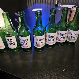 a row of empty beer bottles on a table