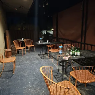 a patio area with tables and chairs