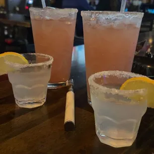 Two raspberry margaritas. Two blue raspberry lemon drops.