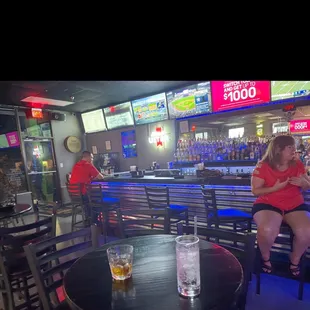 a woman sitting at a bar