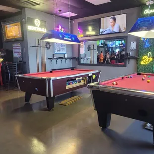 two pool tables in a bar