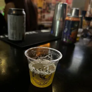 a cup of beer on a bar