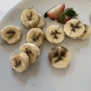 Old and discolored banana slices that garnished the pancakes I was served at the Capitol Grille today at brunch.