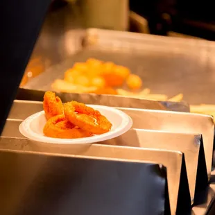 a plate of food on a conveyor belt
