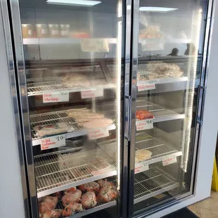 Freezer containing crab, shrimp, octopus, and imported goods.