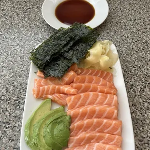Dry Dock Fish Co. Sushi grade salmon with avocado, ginger, Sea Snax, and tamari