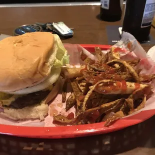a hamburger and fries in a basket