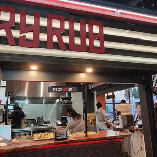 people standing in line at the counter