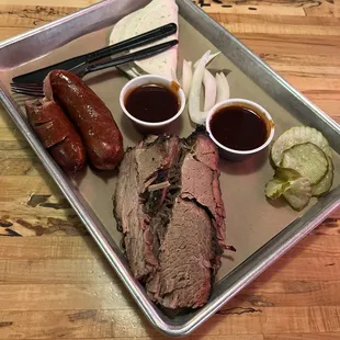 a tray of meat and vegetables