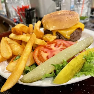 a burger and fries on a plate