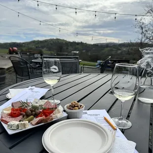 a plate of food and a glass of wine
