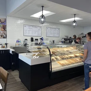 a woman standing in front of the counter