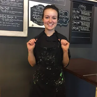 Brook and her colorful apron!  Came out for a moment to say hello - she'd been decorating delicious goodies!