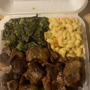 Oxtail platter with Mac and cheese and greens