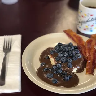 a plate of food and a cup of coffee
