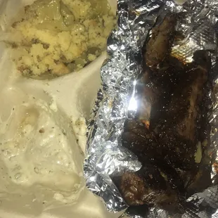 Rib tips, potato salad, and cabbage with cornbread crumbled on top