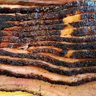 a close up of a sliced brisk
