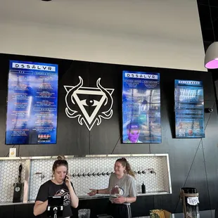 a man and a woman sitting at a bar