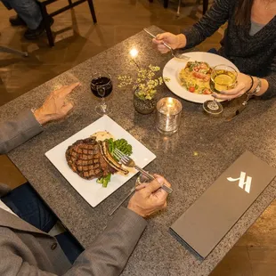 a man and a woman sharing a meal