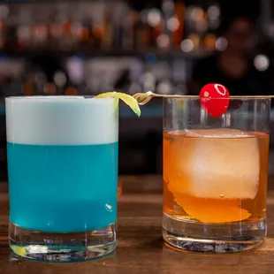 two cocktails on a bar