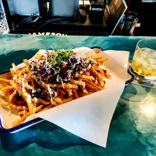 Chii&apos;n at the moment with Jack Daniels Fire on the rocks and Carne Asada fries.... @ the DTC in Chandler.