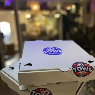 pizza boxes stacked on top of each other
