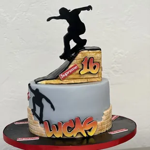 a cake with a skateboarder on top