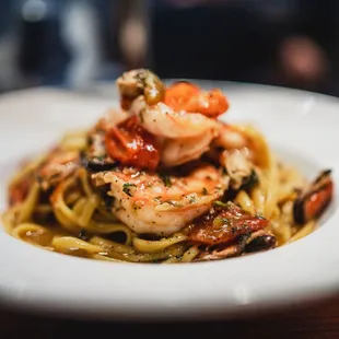 a plate of pasta with shrimp