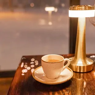 a cup of coffee on a table
