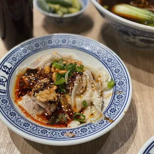 wontons with chili oil sauce, pickled cucumber, braised beef tendon noodle soup @lesminaddio