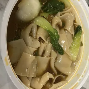 Beef and tendon noodle soup with hand made thick noodles