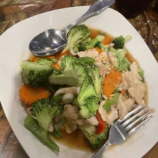 Broccoli and sauce with chicken and rice on the side