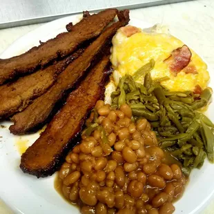 a plate of beans, bacon, and beans