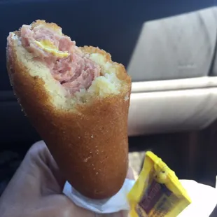 Deep fried corn dog with mustard