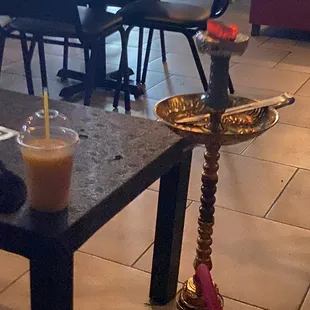  hookah and a drink on a table
