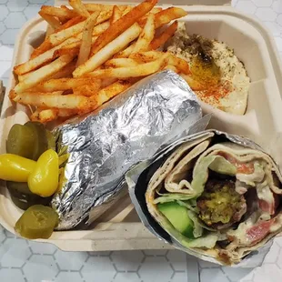 Falafel wrap with fries and hummus.