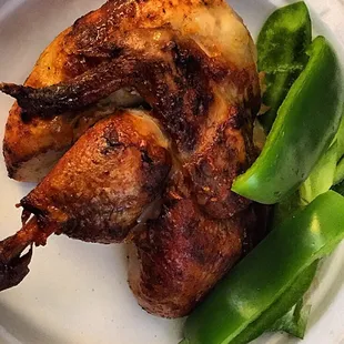 Leftover chicken off the spit. Best chicken, lamb, and pig off the spit I've ever had. They make it every Saturday!