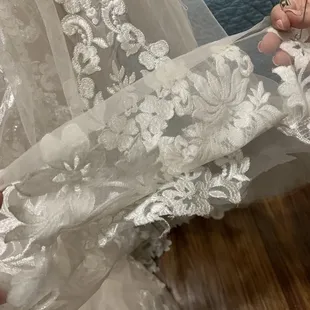 Layers from poor hem! Cut bottom across &amp; moved up. Very uneven &amp; awkwardly layered on top of &amp; beneath. 3 seamstress' confirmed sloppy