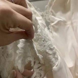 Without reason or consent, Kathy placed appliqué from hem inside what was supposed to be see-through mesh siding. Itchy!