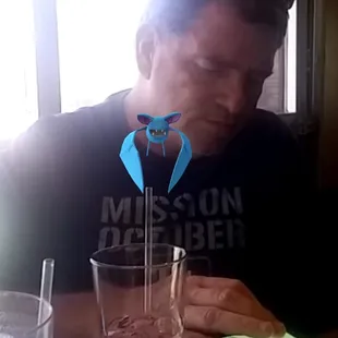 Bob and a Pokemon enjoying his cocktail