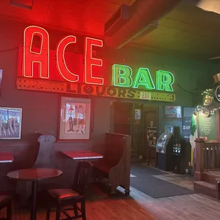 Front of bar, corner stage on right