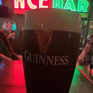 a pint of guinness on the bar