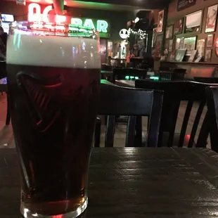 a pint of beer on a table