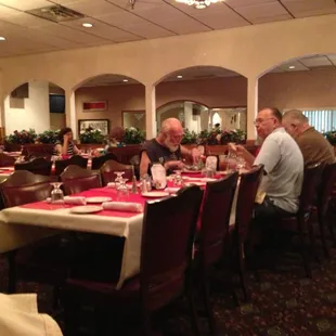 a group of people sitting at a table