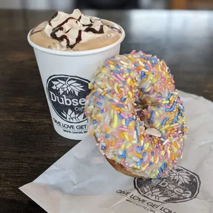 Black and white mocha with whip and the side of donut