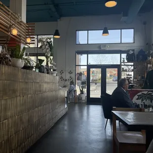 a man sitting at a table in a coffee shop