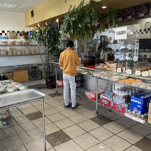 a woman standing in a bakery