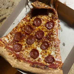 a slice of pepperoni pizza