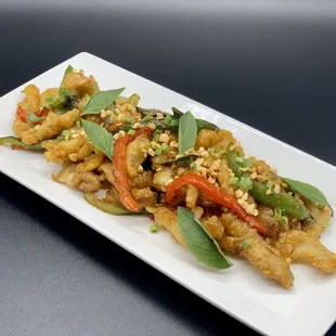 &quot;Shanghai style&quot; Fried Calamari! Tossed with an Orange ginger glaze, Thai basil, topped with crushed peanuts.